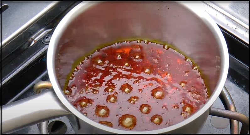simmer over annatto seeds and cooking oil. 